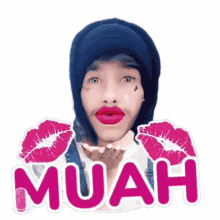 a sticker of a man blowing a kiss with the word muah written below him