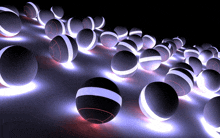 a bunch of glowing balls are lined up on a dark surface