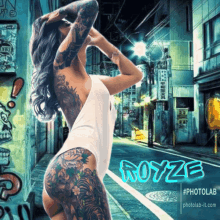 a woman with a lot of tattoos has the name royze on her back