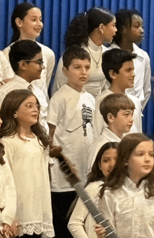 a boy wearing a white shirt that says ' a thousand ' on it