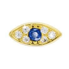 a yellow gold evil eye with a blue stone and diamonds