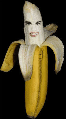 a banana with a face carved into it and a zipper on it