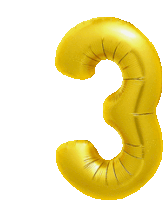 a golden balloon in the shape of the number three