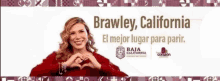 a woman in a red sweater is making a heart shape with her hands in brawley california