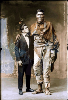 a man and a boy are standing next to each other and the caption says coloured by jim kamp