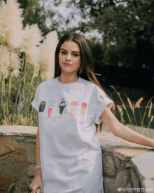 a woman in a white shirt with ice cream cones on it