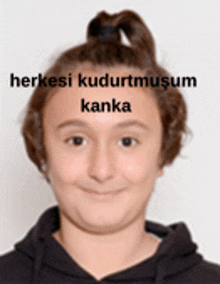 a girl with her hair in a bun is smiling with the words herkesi kudurtmusum kanka on her forehead