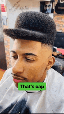 a man with a hat on has a green sticker that says that 's cap on it