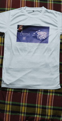 a white t-shirt with shuffle on the front