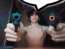 a shirtless man is holding two guns in front of him