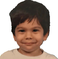 a young boy with a white shirt on is smiling for the camera