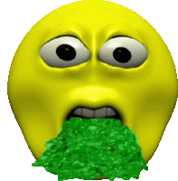 a yellow smiley face with a green substance in its mouth