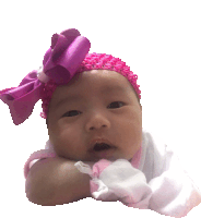 a baby wearing a pink headband with a pink bow