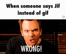 a man is making a funny face while someone says jif instead of gif wrong .