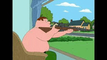 peter griffin is sitting in a chair holding a gun .