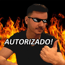 a man wearing sunglasses giving a thumbs up in front of flames and the word autorizado