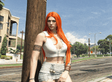 a woman with long red hair is leaning against a pole