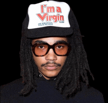 a man wearing a hat that says " i 'm a virgin "