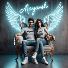 a man and a woman are sitting on a couch under a neon sign that says ayaansh