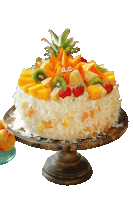 a cake with a pineapple on top has the letters a.c. on the top