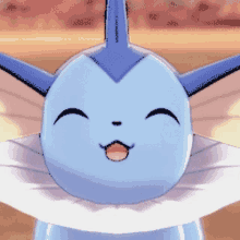 a close up of a blue and white cartoon character with a smile on its face