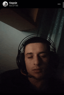 a man wearing headphones with the time of 00:27:55