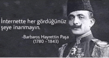 a black and white photo of a man in a military uniform with a quote from barbaros hayrettin pasa