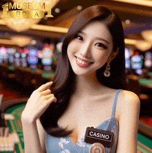 a woman in a blue dress has a name tag that says casino