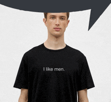 a man is wearing a black t-shirt that says i like men