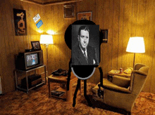 a living room with a man in a suit and tie standing in front of a television .