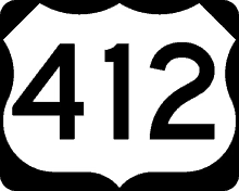 a black and white highway sign with the number 412 on it