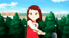 a girl in a red and white outfit is holding a stick