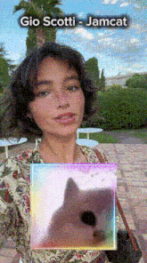 a girl with a picture of a cat and the name gio scotti jamcat
