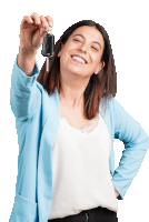 a woman in a blue jacket is holding a car key and smiling