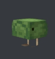 a green block with a hole in the middle of it is standing on two legs in a minecraft game .