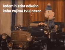 a cartoon character is driving a car with the words jedem hledat nekoho roho zajima tvoj nazor above him