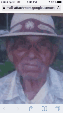 an old man wearing a hat is displayed on a sprint phone screen