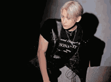 a person wearing a black shirt that says personality