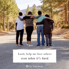 a group of people hugging each other on a road