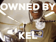 a picture of a man with the words " owned by kel " above him