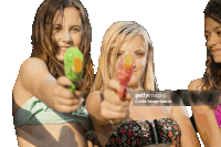 three young women in bikinis are holding water guns in their hands