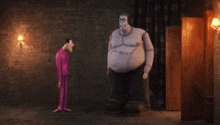 two cartoon characters standing next to each other in a dark room