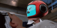 a red robot with a blue face and the words beep boop below