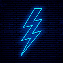 a neon lightning bolt is lit up on a dark blue brick wall