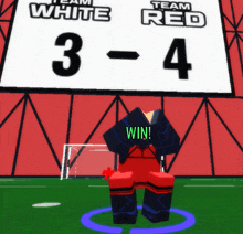 a soccer player stands in front of a scoreboard that says team white and team red on it