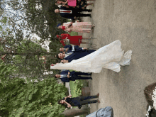 a bride and groom pose for a picture with their wedding party