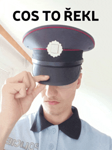 a man in a police uniform covering his face with his hat with the words cos to rekl above him