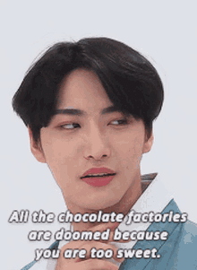 a close up of a young man 's face with a caption that says all the chocolate factories are doomed