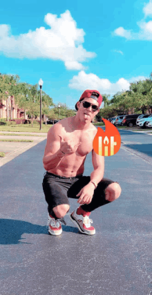 a man without a shirt is squatting down in front of a sign that says lift