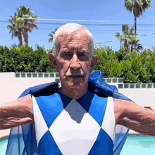 a man in a blue and white superhero costume